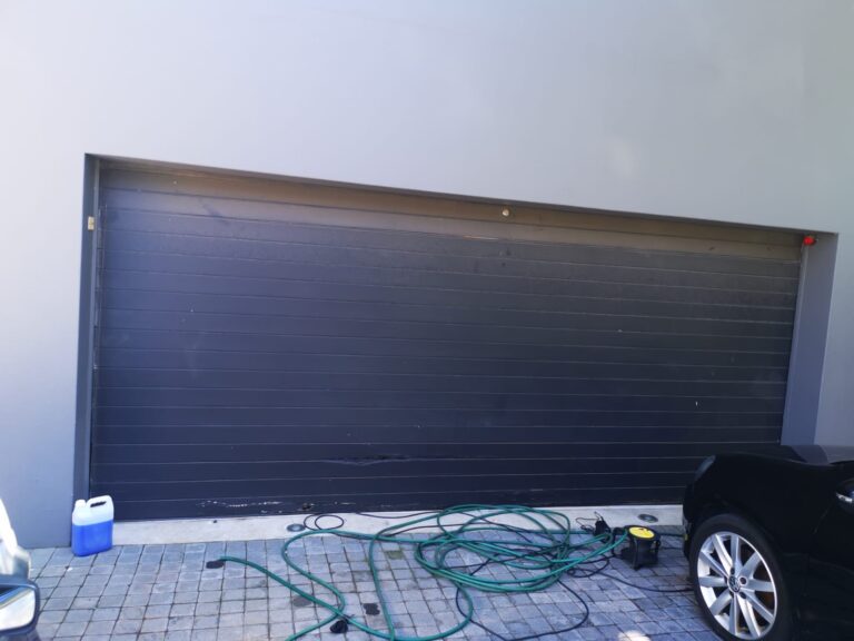 Broken garage door panels that need to be repaired GP Garage Door Repair Fourways 768x576